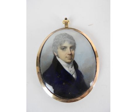George Engleheart (British, 1750-1829)Portrait of a gentleman wearing a dark blue double-breasted coat with a black collar, o