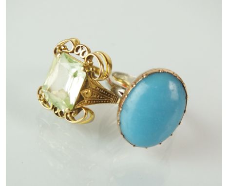 An oval cabochon turquoise ring, claw set within yellow metal to later white metal shank, size N 1/2, together with a single 