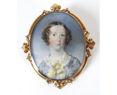 Francis Hargreaves (British, active 1810-1854)A portrait miniature of a lady wearing a blue dress and yellow scarf, oval 6cm 