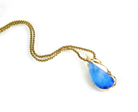 A boulder opal and diamond pendant, the drop shaped opal plaque claw set in yellow metal and mounted within single brilliant 