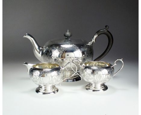 A three piece silver tea service, Cooper Brothers & Sons Ltd, Sheffield 1916 & 1917, each piece of circular form with bright 