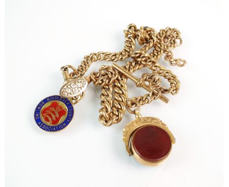 A 9ct rose gold curb link albert, with attached T-bar, bloodstone and carnelian fob, a 9ct gold and enamel bowling fob and tw