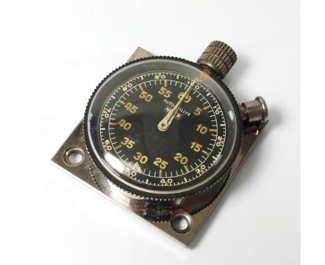 A Heuer Auto-Rallye stop watch, the black dial with Luminous Arabic numerals and an outer ring of white Arabic numerals, with