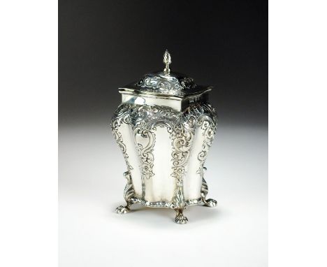A Victorian silver tea caddy, CH, Birmingham 1900, of bombe form with chased floral scroll decoration, wrythen finial and rai