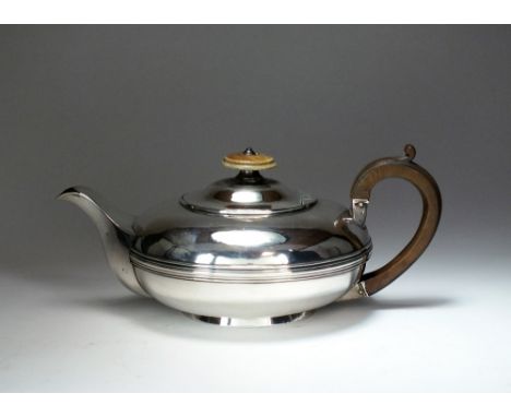 A George IV silver teapot, Rebecca Emes & Edward Barnard I, London 1823, of squat circular form with reeded band to the waist