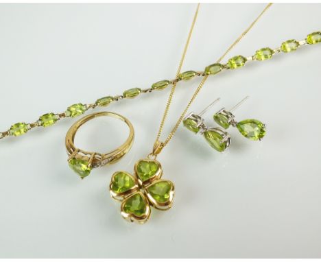 An 18ct gold four stone peridot pendant, suspended from 9ct gold chain, together with a peridot set bracelet, stamped '9k', a