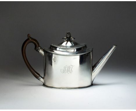 A George III silver teapot, T.S., London 1791, of oval plain polished form with engraved initials to the body, turned wood ha