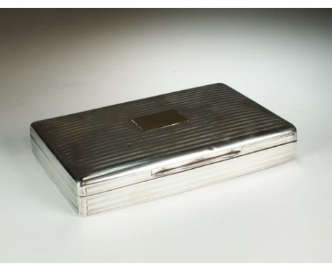 A silver mounted cigarette box, Mappin & Webb, London 1917, of rectangular form with engine turned decoration and yellow meta