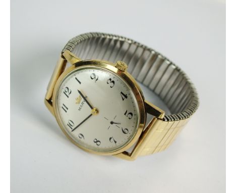 A Gentleman's 9ct gold Marvin wristwatch, the circular silvered dial with Arabic numerals and subsidiary seconds dial, manual