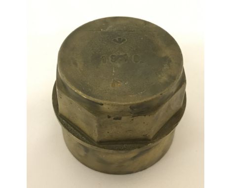 A British brass cannon-wagon wheel hub. Marked with war dept arrow and stamped 1918. Approx 8.5cm.
