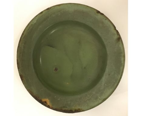A green enamel Vietcong/North Vietnamese Army (N.V.A) plate. With star motif stamped to reverse. Approx. 20cm diameter.