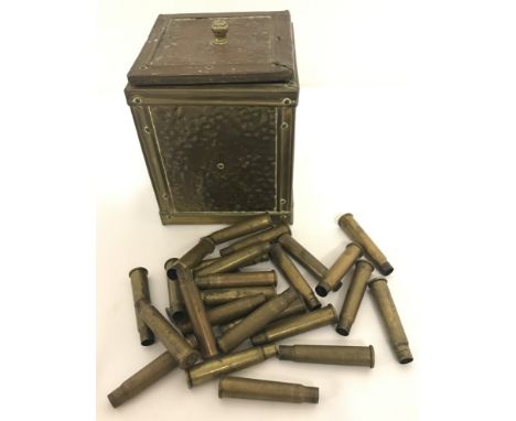 A collection of 26 .303 cases dating from 1917 - 1943. Inside a officers tea caddy. 