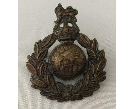WW2 style British Royal Marine Commando Cap badge with concealed button escape compass. Approx. 4.75cm x 4cm.