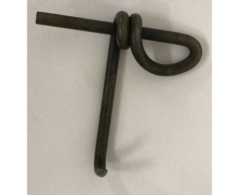 A WW1 style Mills Grenade ring puller.  Approx. 8.5cm².
