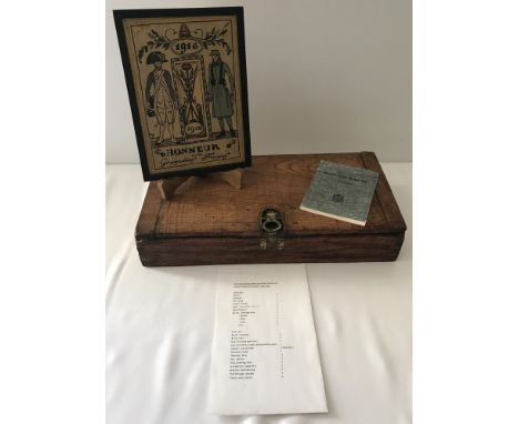 A Hotchkiss M1929 wooden machine gun tool box with a reprint handbook and tool list. Together with a framed Honneau Grenadier