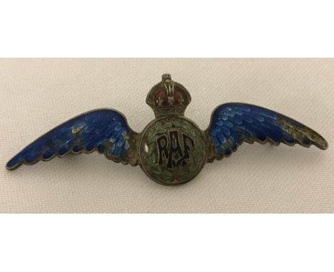 A sterling silver enamelled RAF wings bade. Pin missing from back, some damage to blue enamel on wings and one green leaf. 