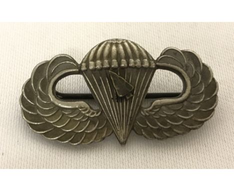 WW2 style US Para wings badge with arrow head to signify a Normandy drop. With hallmarks to reverse and marked Spencer, Londo