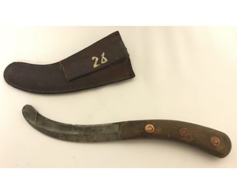 A war department parachute knife with leather scabbard. Marked Air Ministry with war department arrow. 