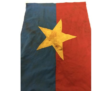 A Vietnam War era North Vietnamese flag. In red and blue cotton with gold star motif. Approx. 56cm x 76cm.