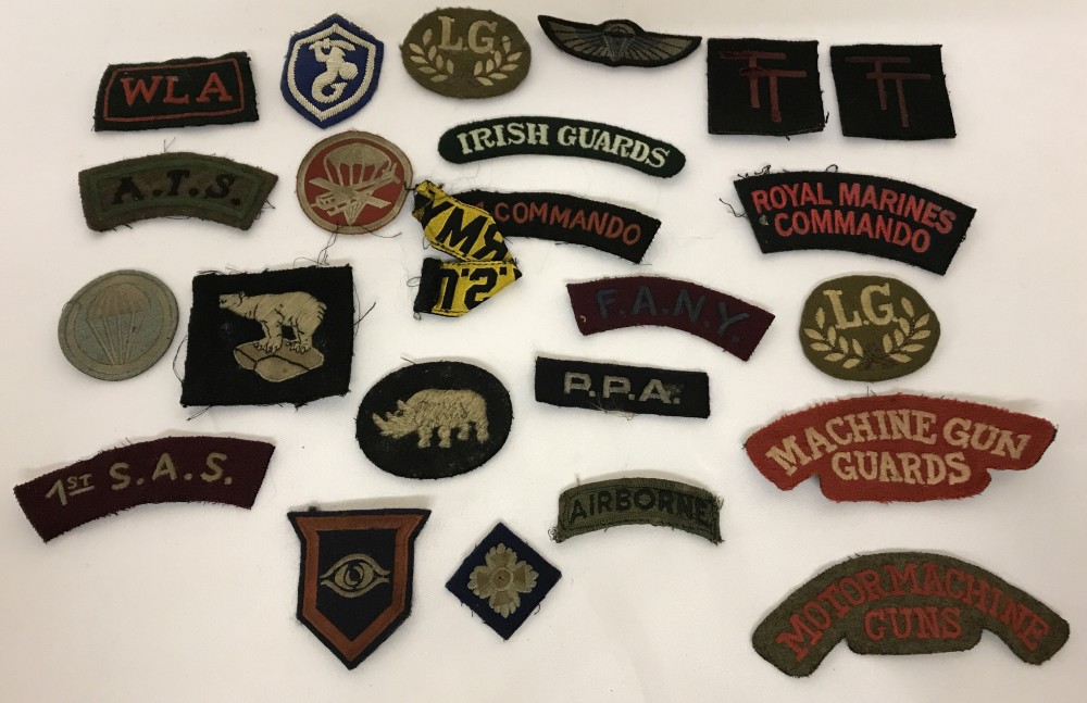 24 Assorted Military Uniform Cloth Patches and badges of various designs.