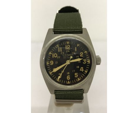 Vietnam interest US Navy (Marines) Vietnam War style manual wind up watch. With green canvas strap and luminescent hands. 