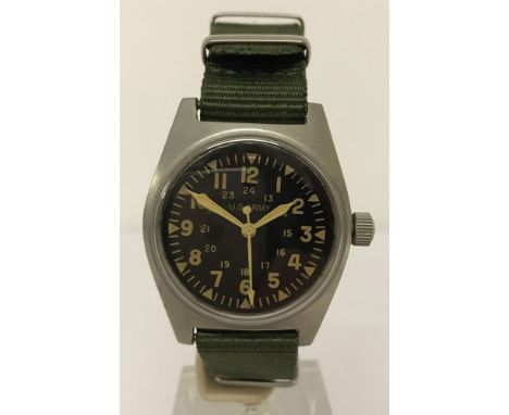 Vietnam interest US Army Vietnam war style manual wind up wrist watch. With green canvas strap and luminescent hands. 