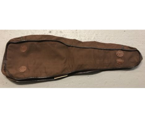 A brown canvas Leg 'O' Mutton gun case cover.  