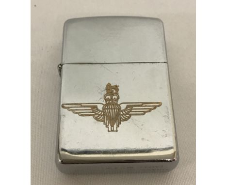 A silver tone wind proof lighter engraved with Parachute Regiment logo.  
