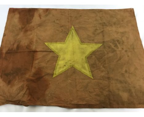 A Vietnam War era North Vietnamese flag. In orange cotton with gold star motif. Approx. 56cm x 76cm.
