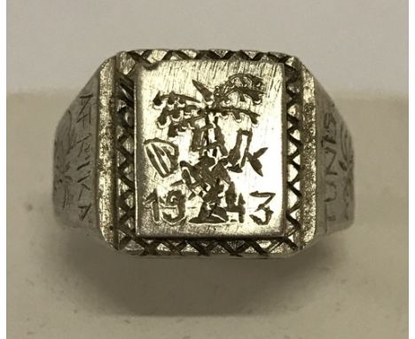 A WW2 style D.A.K (Africa Corps) white metal ring with palm tree etched design.  Ring size Y.