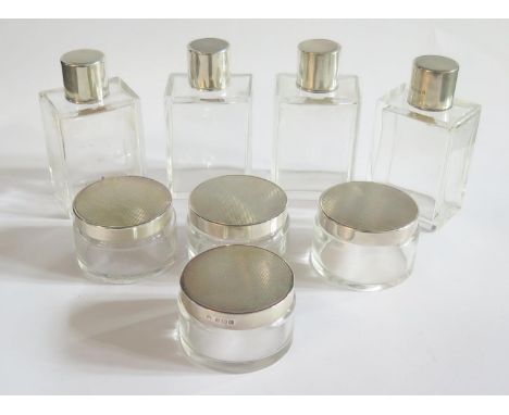 A Set of Eight George V Art Deco Silver Top Bottles with engine turned decoration, Birmingham 1914, Adie Bros., bottles 10cm 