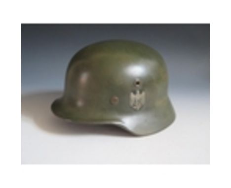 A German WWII Army DD Helmet, rim stamped Q66 &amp; DN311, leather stamped 58, no chin strap, REPAINTED AND DECALS ADDED