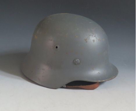 A WWII German Luftwaffe Helmet, printed in ink 854, impressed 4451 ET62 and leather insert 54 