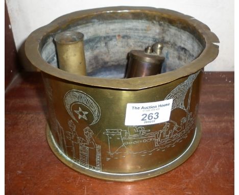 WWI Trench Art brass shell case, dated 1916 with incised decoration of Middle Eastern scenes with figures, buildings and sail
