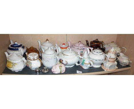 A china teapot collection on one shelf