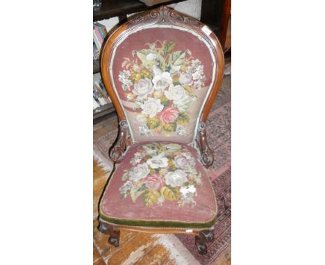 19th c. carved walnut show frame spoonback nursing chair, upholstered in tapestry and beadwork on carved cabriole legs