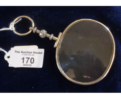 Antique white metal magnifying glass or magnifier on hanging ring