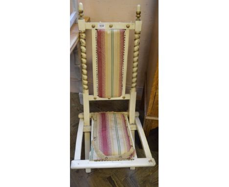 A painted folding chair, a folding card table, a director's chair and an "X" frame stool