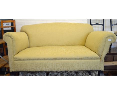 A cream upholstered Victorian drop end sofa