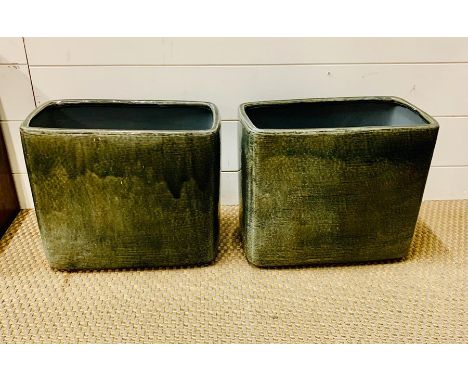 A pair of two glazed ceramic plant pots 