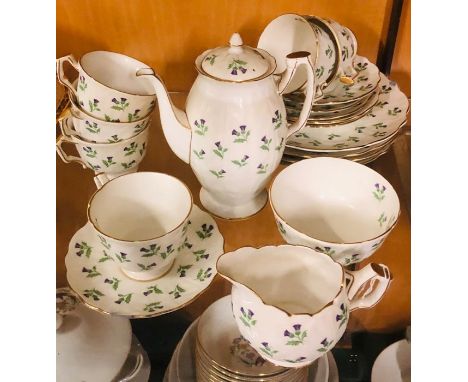 An Aynsley lilac Thistle tea set to include six cups and saucers, a tea pot, sugar bowl, milk jug and four plates 