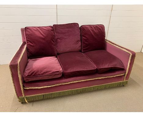 A three seater velvet sofa 