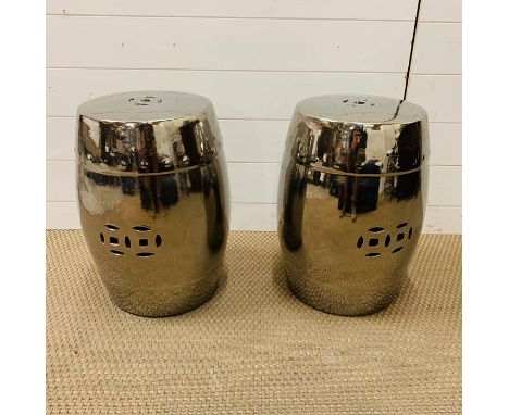 A pair of metallic oriental ceramic stools 
