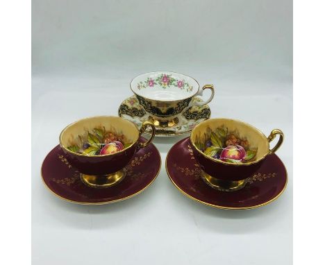 A selection of three cups and saucers by Aynsley and Elizabethan 