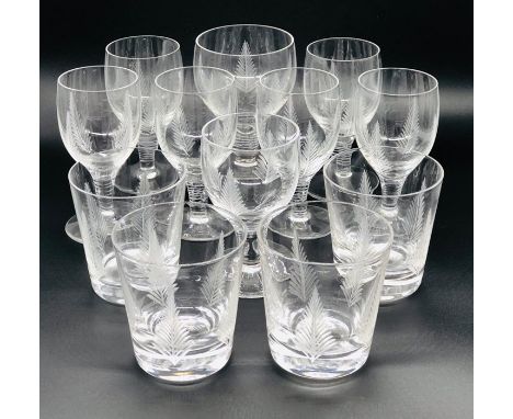 A selection of eleven glasses with an etched fern pattern to include four tumblers, six port glasses, a small wine goblet and