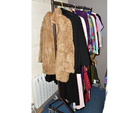 A QUANTITY OF LADIES' CLOTHING, many 1980s and more modern pieces, to include a light brown fur jacket, a sheepskin coat, a t