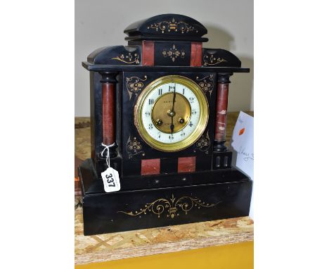 A LATE VICTORIAN BLACK SLATE MANTEL CLOCK, with red marble columns, gilt foliate carved decoration to front panels, a white e