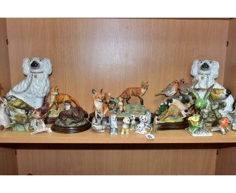 A COLLECTION OF ANIMAL AND BIRD FIGURES, to include a pair of Staffordshire style fireside spaniels, height 24.5cm (crazing a