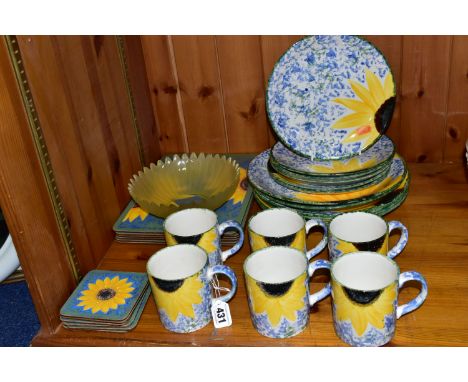 A SET OF HAND PAINTED POOLE POTTERY SUNFLOWERS PATTERN DINNER WARES, comprising six dinner plates, six side plates, six mugs,