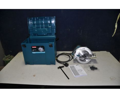 A MAKITA HS7601J CIRCULAR SAW 240v with plastic carry case, parallel guide, manual and dust tube